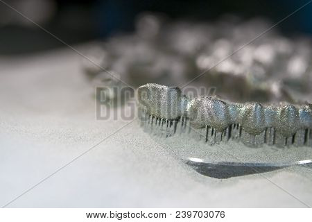 Object Printed On Metal 3d Printer, Laser Sintering Machine For Metal Close-up. Metal Dental Crowns 