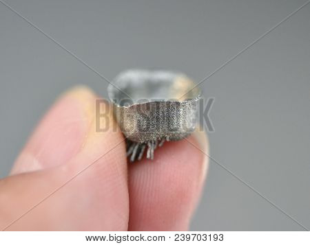 Small Object Printed On Metal 3d Printer Macro. Dental Crowns Created In Laser Sintering Machine Clo