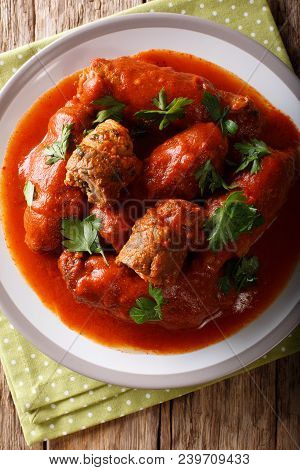 Italian Meat Roll Braciole Stuffed With Parsley And Cheese In Tomato Sauce Close-up. Vertical Top Vi