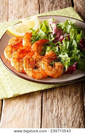 Honey Soy Shrimp And Fresh Salad Close-up On A Plate. Vertical