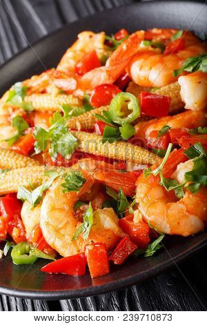 Fried Prawns With Pepper, Garlic, Corn Cob And Herbs Close-up. Vertical