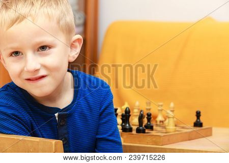 Intelligent, Smart Ass Kids, Games Good For Brain Intelligence Concept. Young Kid Boy Playing Chess 