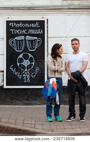 Moscow, Russia - April 30, 2018: People Near The Chalkboard On Solyansky Proezd With The Advertiseme
