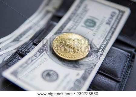Close Up Golden Coin Bitcoin On Us Hundred Dollars On Leather A Wallet With Full Of Money. Profit Fr