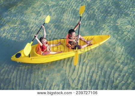 Asian Kid To Play Kayak On The Beach On Koh Kood And Koh Mak, Koh Kood And Koh Mak Is Island On The 