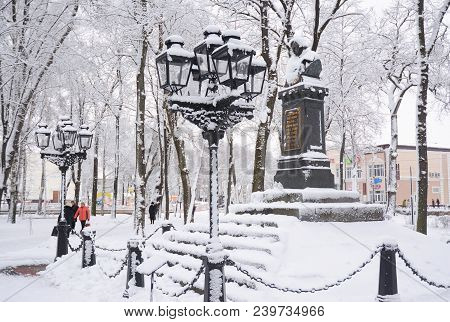 Nizhyn, Ukraine - February 15, 2018: Nikolai Gogol First Monument In Nizhyn, Ukraine, Coverd Snow.