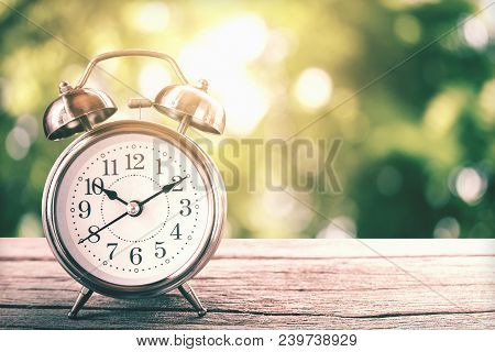 Retro Clock Vintage Color Tone In The Garden With Morning Sunlight And Copy Space For Design
