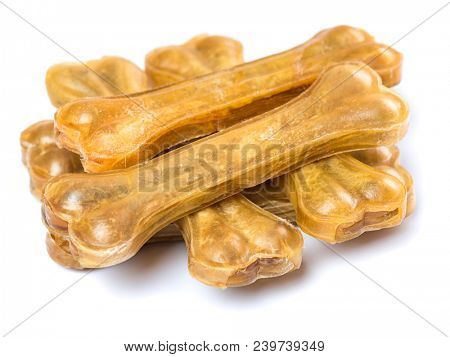 Artificial dog chew bone food with vitamins isolated on white background