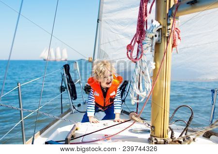 Kids Sail On Yacht In Sea. Child Sailing On Boat.