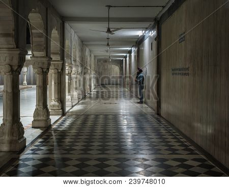 The Lonely Sikh Makes A Prayer In The Yard Of The Temple Of Gurudwara Bangla Sahib In A Gallery Of S