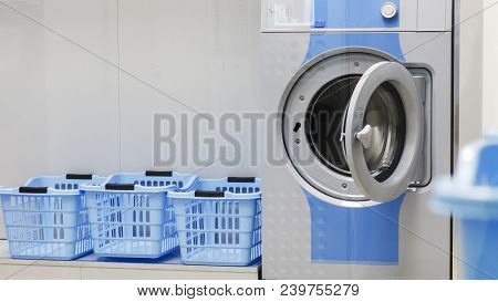 Washing Machine And Laundry Baskets In The Self Service Laundry