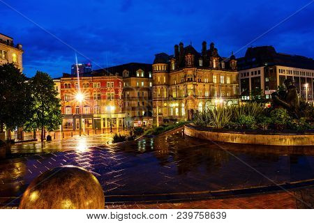 Birmingham, Uk. Victoria Square At Night With Illuminated Buildings, Cafes, Shops And Hotels In Birm