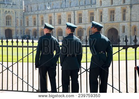 Windsor, Uk - May 5, 2018: Her Magesty Soldiers Walking Around The Castle On Duty. Windsor Castle Be