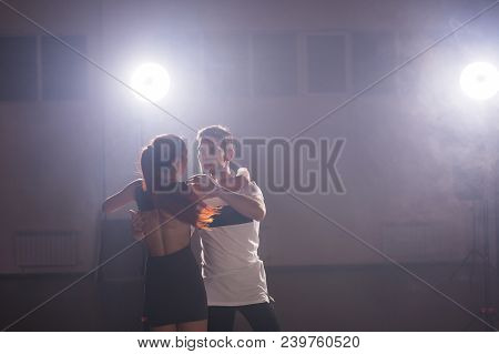 Young Couple Dancing Social Danse Kizomba Or Bachata Or Semba Or Taraxia In Dancing Class Background
