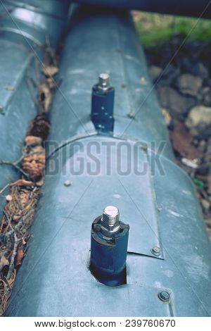 Flanges And Valves Are Mounted On A Ground Made Of Welded Steel Pipes. Metal Pipe Flanges With Bolts