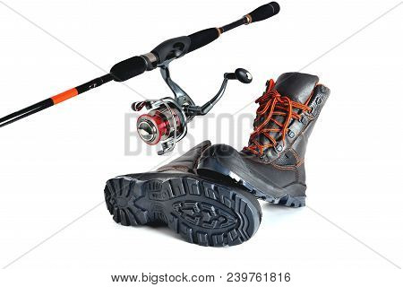 Spinning With A Reel And Off-road Shoes With Orange Laces On A White Background, Isolate