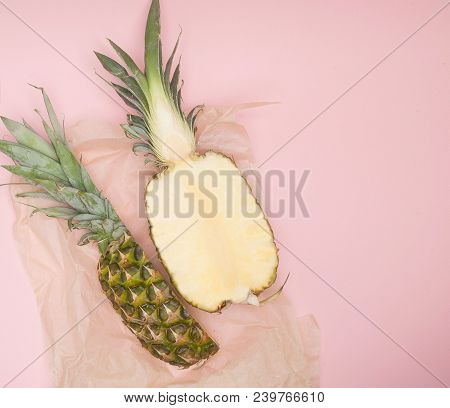 Half Cut Juicy Pineapple On A Pastel Pink Background. Minimal Summer Concept.