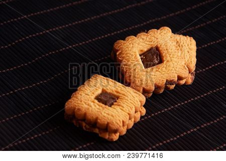 Chocolate Sand Chip Cookies Stacked Up On A Plate, Ready To Be Served.