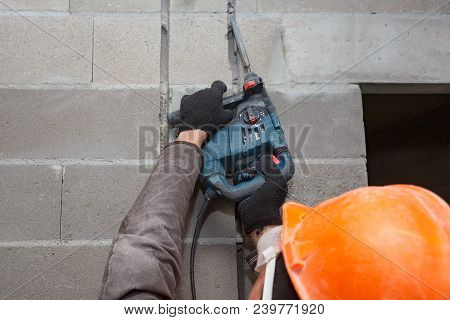 Slotting Of The Wall Under The Wiring With A Perforator.