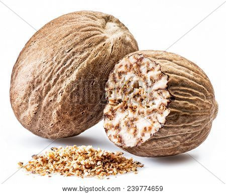 Dried seeds of fragrant nutmeg and grated nutmeg  isolated on white background.