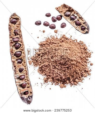 Carob pod and carob powder on the white background.