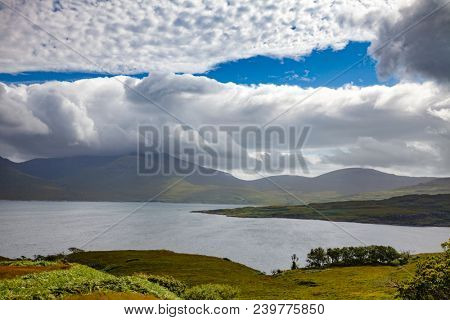 Scottish summer landscape with moody sky over sea Loch na Keal on Atlantic coastline of the Isle of Mull, Inner Hebrides, Scotland, UK