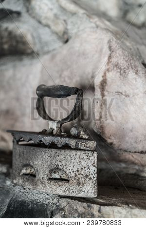Old Vintage Iron On The Charcoal On Display In Museum