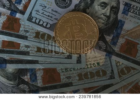 Golden Bitcoin On Us Dollar Bills Background. Virtual Money Cryptocurrency. Business Concept.