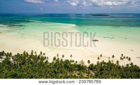 Aerial shot of deserted tropical Ohoidertawun beach with vast area of white sand, Kei Kecil island, Maluku, Indonesia