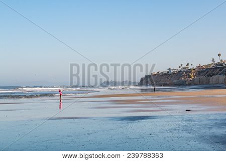 Solana Beach, California/usa - April 22, 2018:  A Small Child Stands Alone On The Shore At Low Tide 