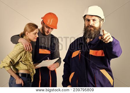 Recruitment Concept. Brigade Of Workers, Builders In Helmets, Repairers And Lady Discussing Contract