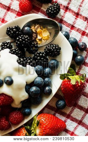 Macro View Of Blackberries, Blueberries, Raspberries And Muesli