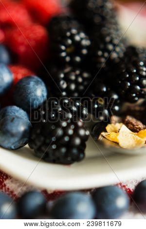 Macro View Of Blackberries, Blueberries, Raspberries And Muesli