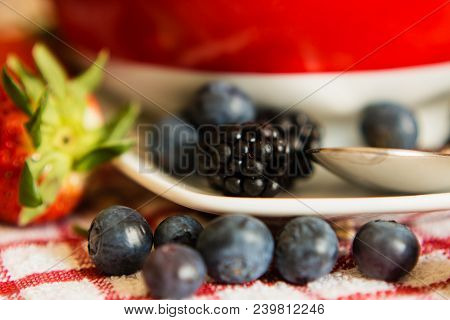 Macro View Of Blackberries, Blueberries, Strawberries And Muesli