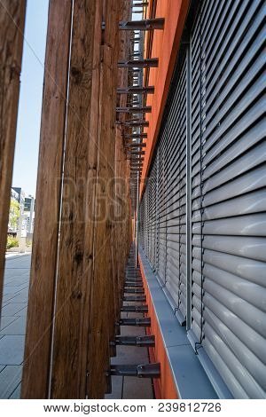 Wooden Profiles Lattice In Modern Architecture Building.