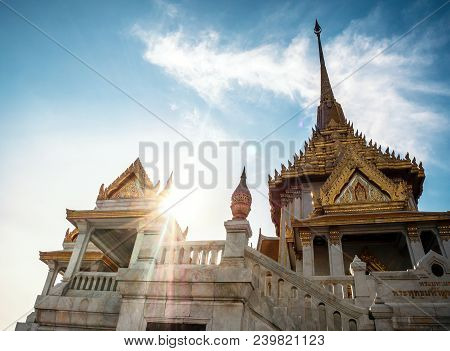 Majestic Temple In Bangkok, Thailand With Blue Sky And Sun