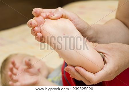 Mother Looking At His Son's First Sign Of Chicken Pox
