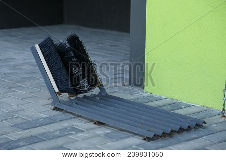 Shoe Cleaning Brushes At The Entrance Of A House.