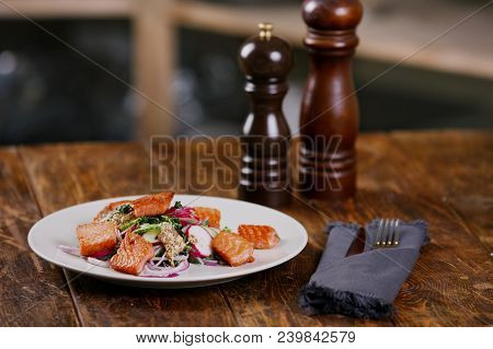 Red Fish Salmon With Radish And Spinach, Served On White Plate On Wooden Table. Rustick Style. View 