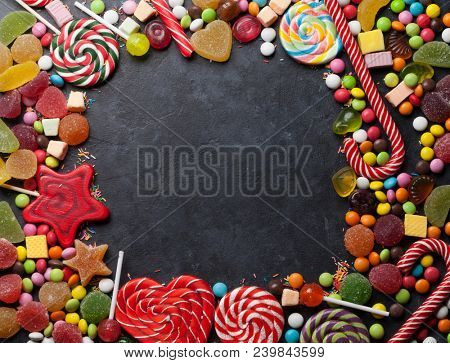 Colorful sweets. Lollipop and candies. Top view with space for your text