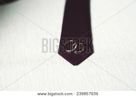 Two Golden Wedding Rings Isolated Background Concept.