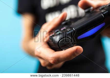 Male hands holding a PS4 controller