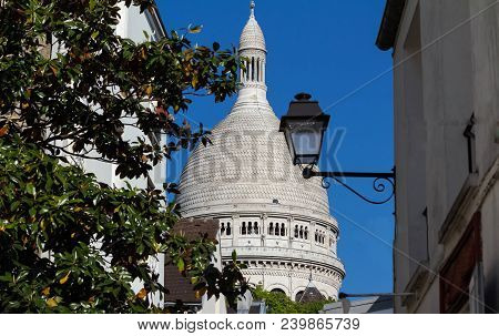 The Basilica Sacre Coeur Is A Roman Catholic Church Located At The Summet Of The Butte Montmartre , 