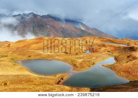 Majestic Mountain Landscape. Koruldi Lakes And A Tourist Admiring The View. Active Life Concept.