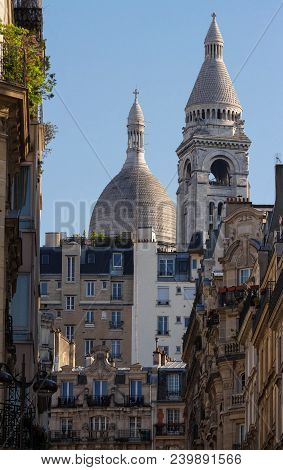 The Basilica Sacre Coeur Is A Roman Catholic Church Located At The Summet Of The Butte Montmartre , 