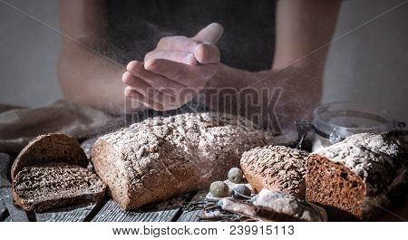 Baker With Flour In Hand