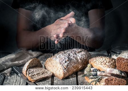 Baker With Flour In Hand