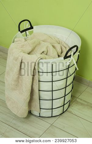 Laundry Basket On The Background Of The Washing Machine.