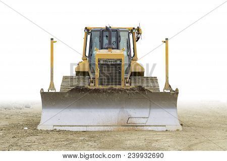 Frontal Shot Of Ayellow Bulldozer At A Loamy Construction Site, Partly Isolated In White Back