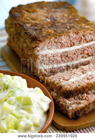 Greek Style Meatloaf With A Feta Filling And A Salad To The Side Shot In A Seletive Focus, Copy Spac